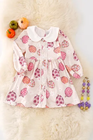 DRG42124 NAY: Pumpkin printed dress w/ bubble sleeve. 